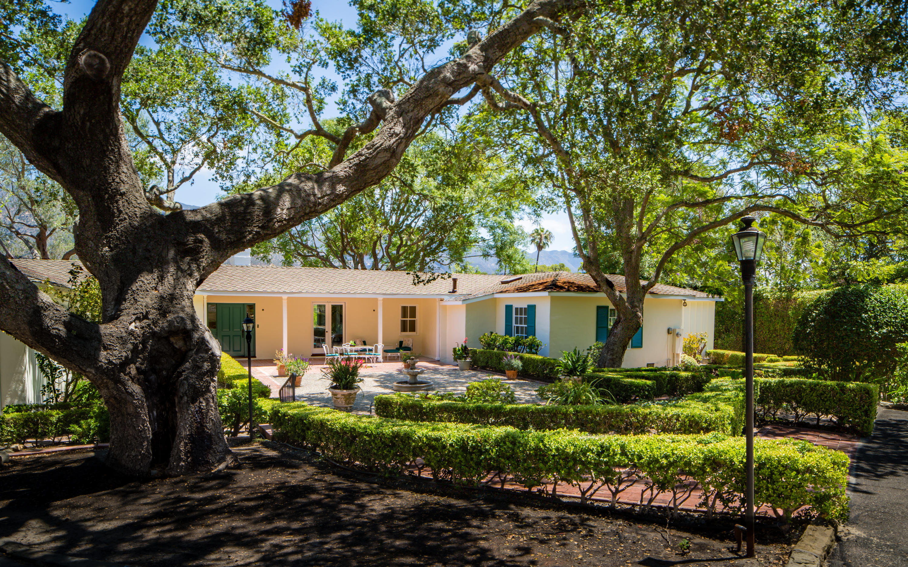 80 Conejo Road Santa Barbara, CA 93103 - Photo 3 of 11 a front view of house with yard and green space