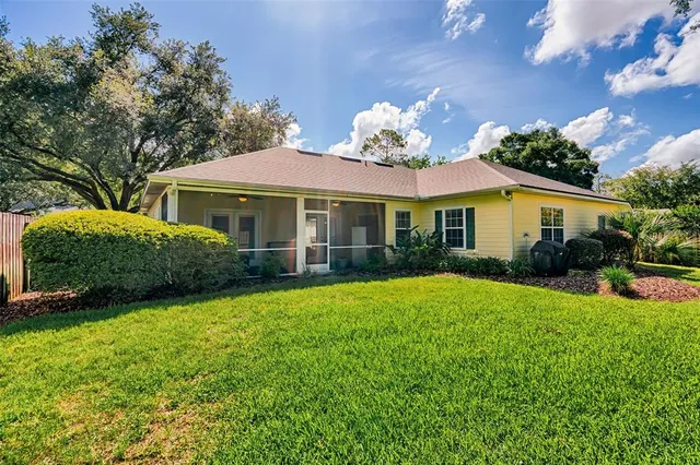 a view of backyard with a garden and entertaining space