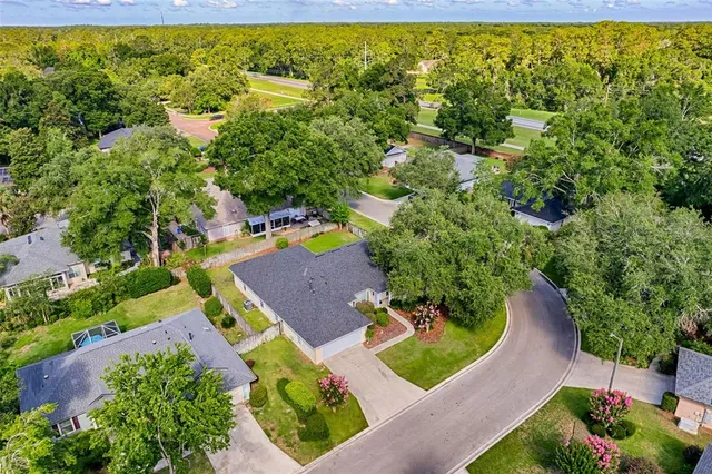 an aerial view of a house with outdoor space pool seating area and yard