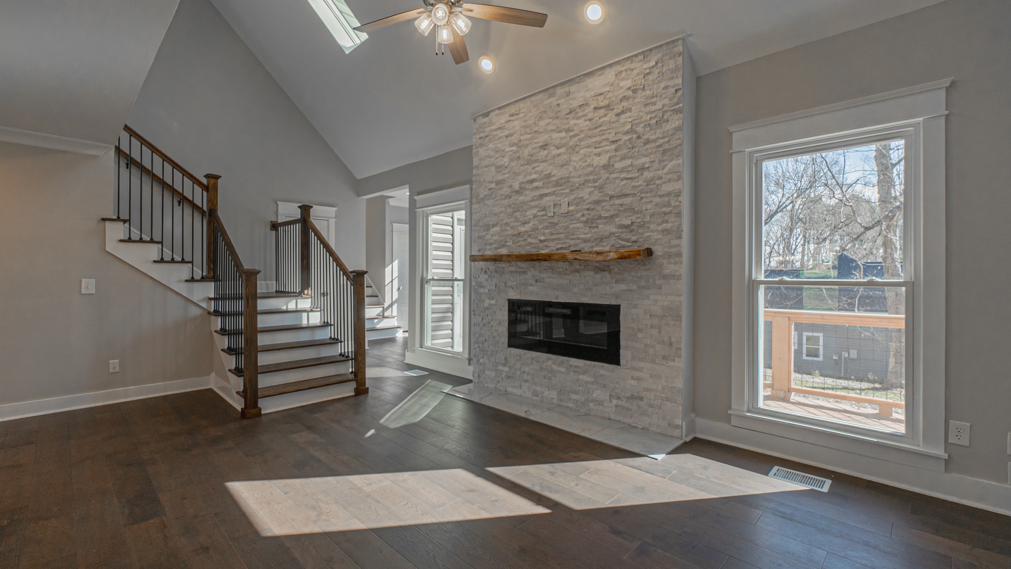 3445 Forest Park Road Springfield, TN 37172 - Photo 10 of 46 a view of an empty room with wooden floor fireplace and a window