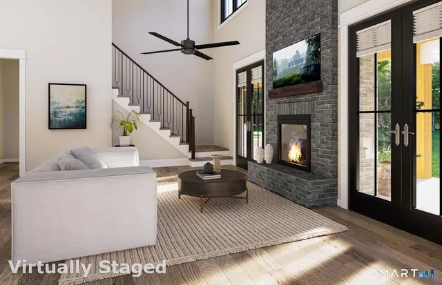 a living room with furniture and a fireplace