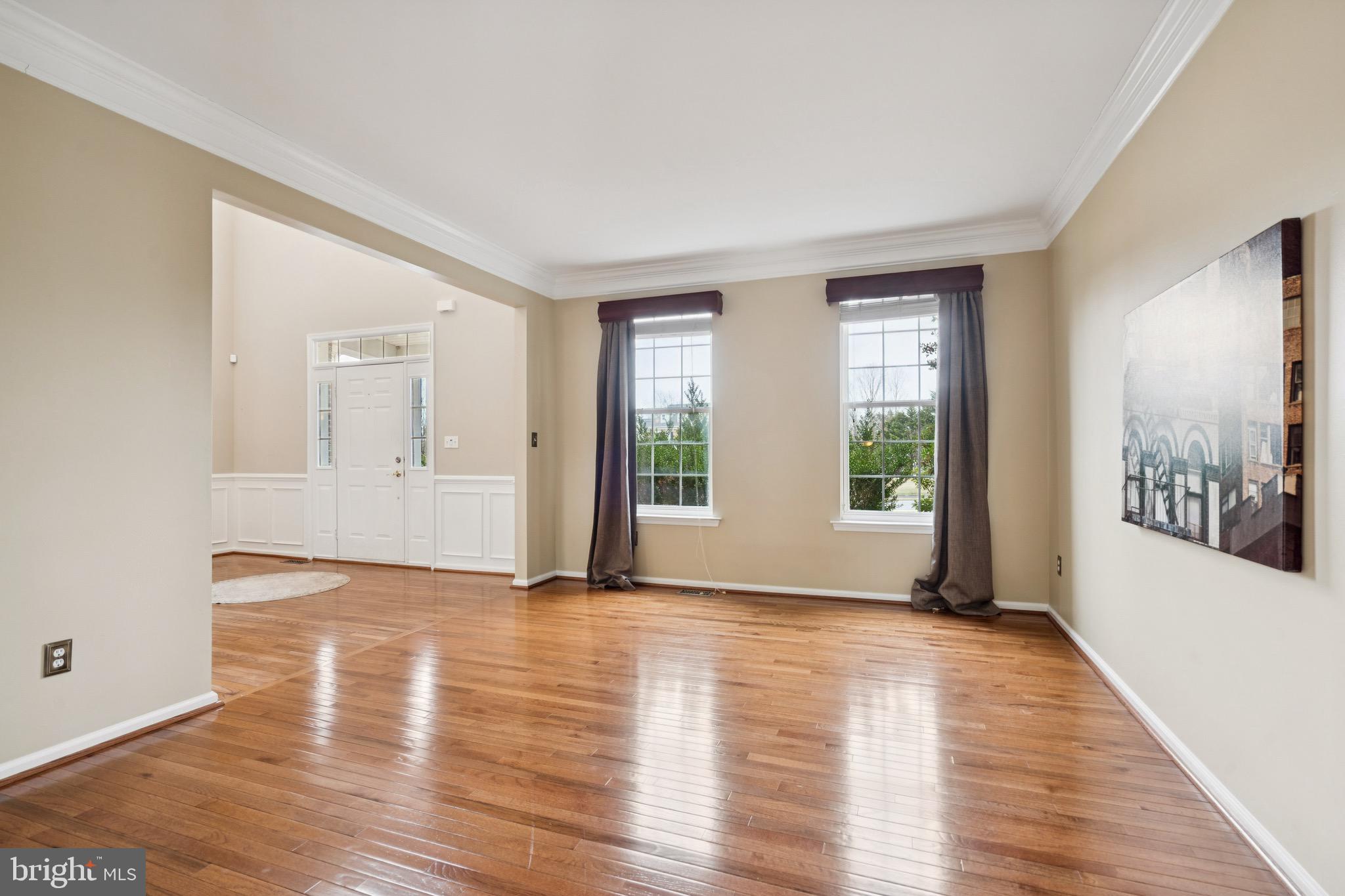 253 Jennings Way Mickleton, NJ 08056 - Photo 6 of 62 a view of an empty room with wooden floor and a window