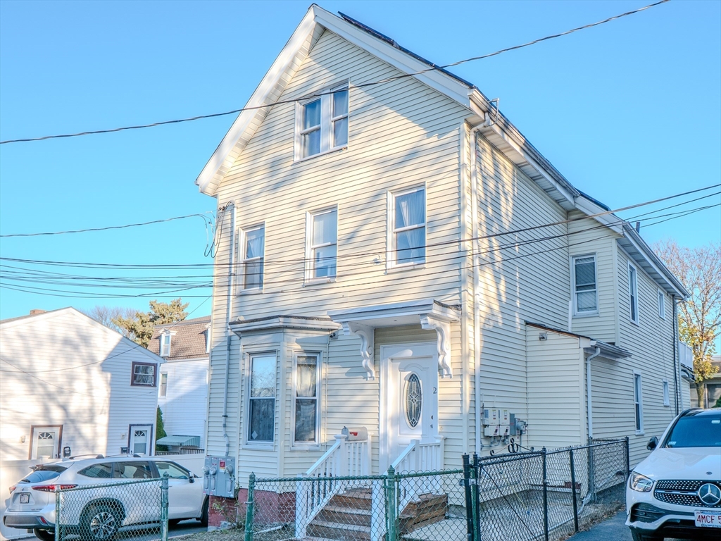 a view of a house with a street
