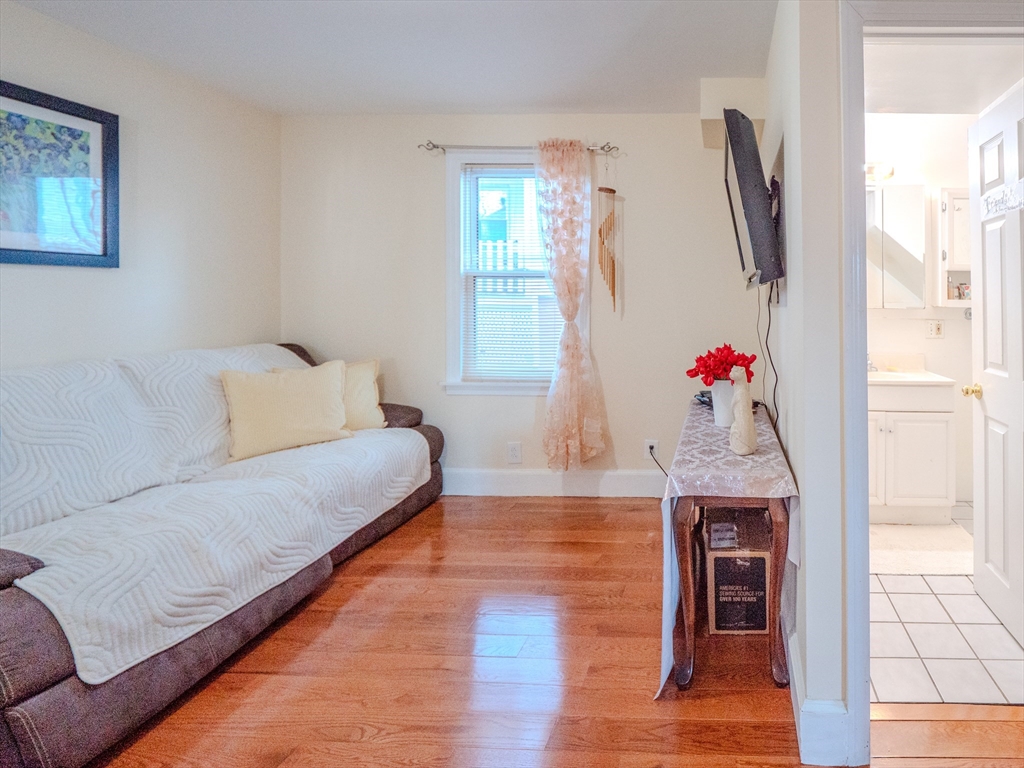 2 Hillside Avenue Somerville, MA 02145 - Photo 12 of 40 a living room with furniture and a window