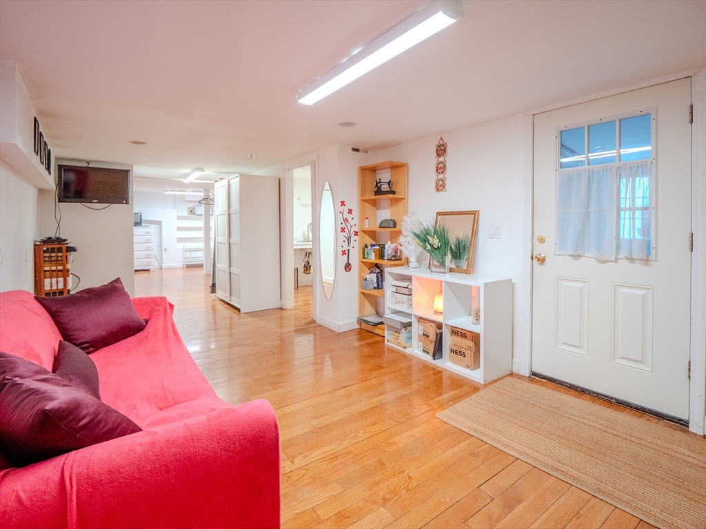 2 Hillside Avenue Somerville, MA 02145 - Photo 19 of 40 a living room with furniture and wooden floor
