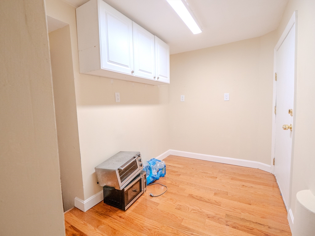 2 Hillside Avenue Somerville, MA 02145 - Photo 20 of 40 a view of a room with wooden floor