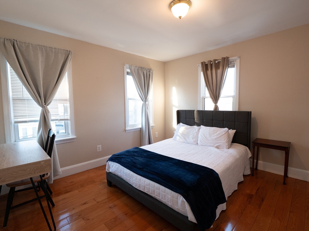 2 Hillside Avenue Somerville, MA 02145 - Photo 35 of 40 a bedroom with a bed and a window