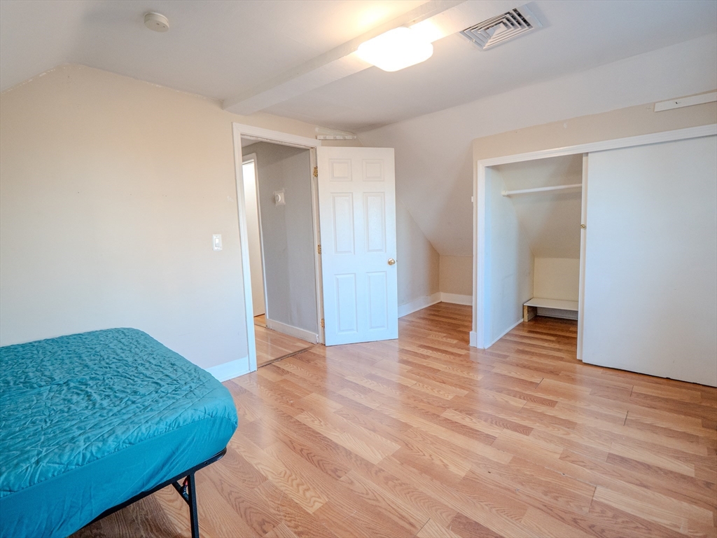 2 Hillside Avenue Somerville, MA 02145 - Photo 39 of 40 a view of an empty room and wooden floor