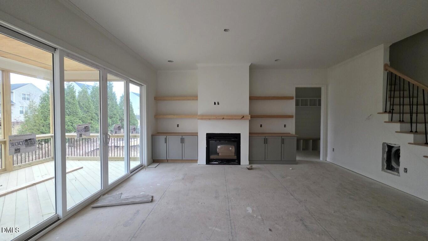 824 Willow Tower Court Rolesville, NC 27571 - Photo 16 of 30 a view of a livingroom with an empty space and a fireplace