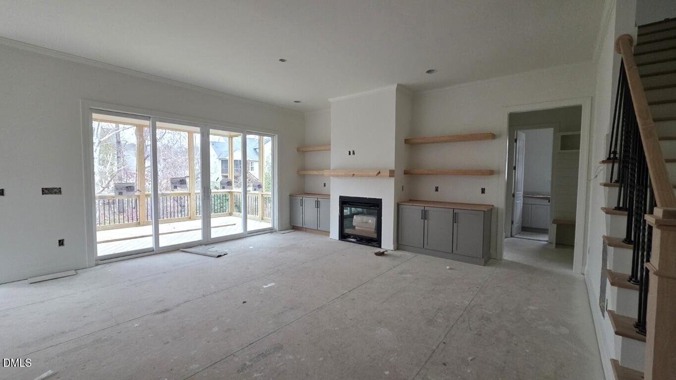 824 Willow Tower Court Rolesville, NC 27571 - Photo 17 of 30 a view of an empty room with a fireplace and a window