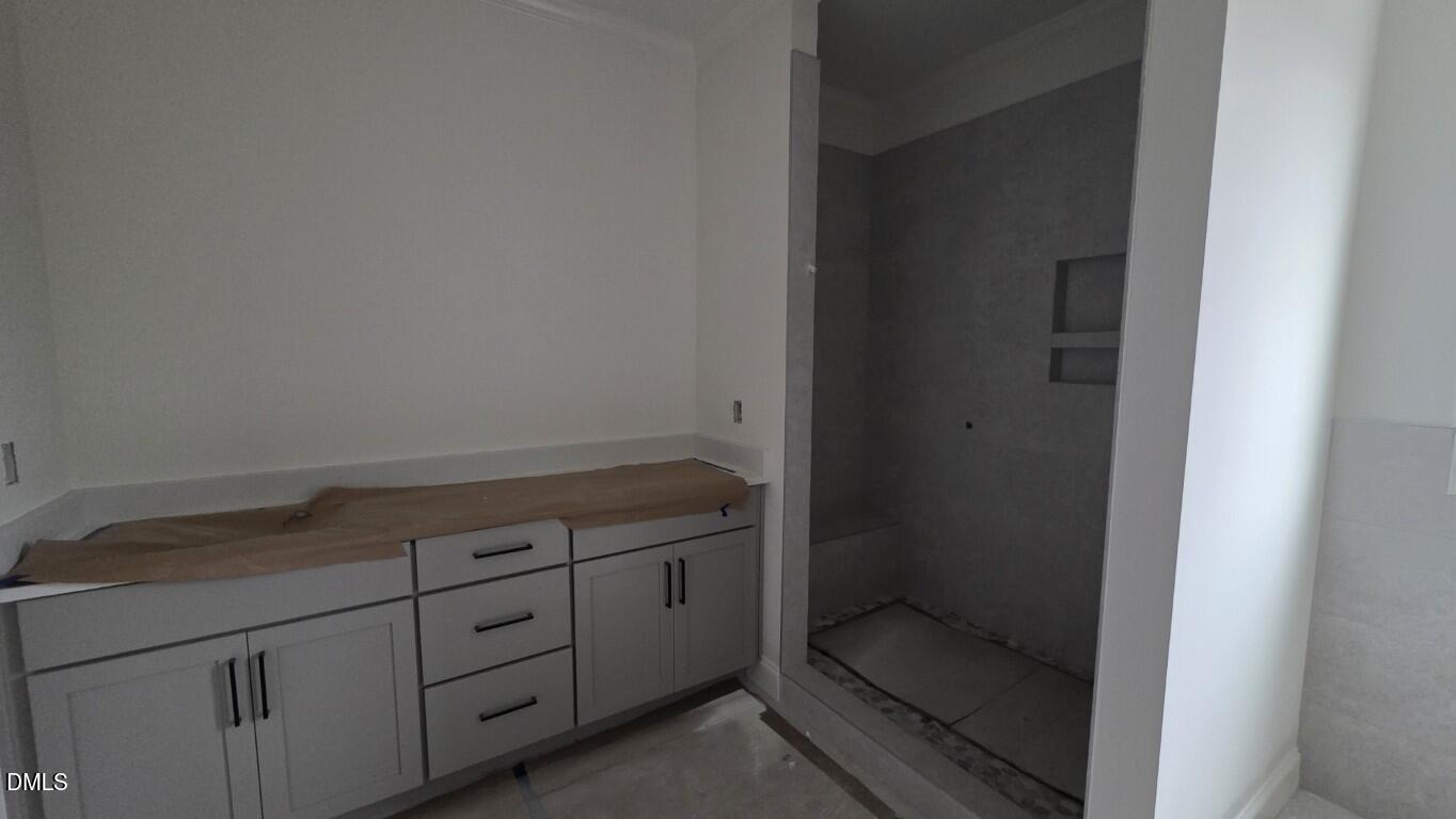 824 Willow Tower Court Rolesville, NC 27571 - Photo 19 of 30 a bathroom with a granite countertop sink