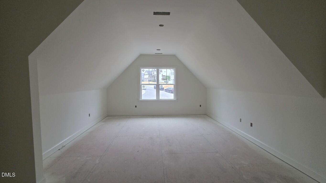 824 Willow Tower Court Rolesville, NC 27571 - Photo 24 of 30 an empty room with a window and a fireplace