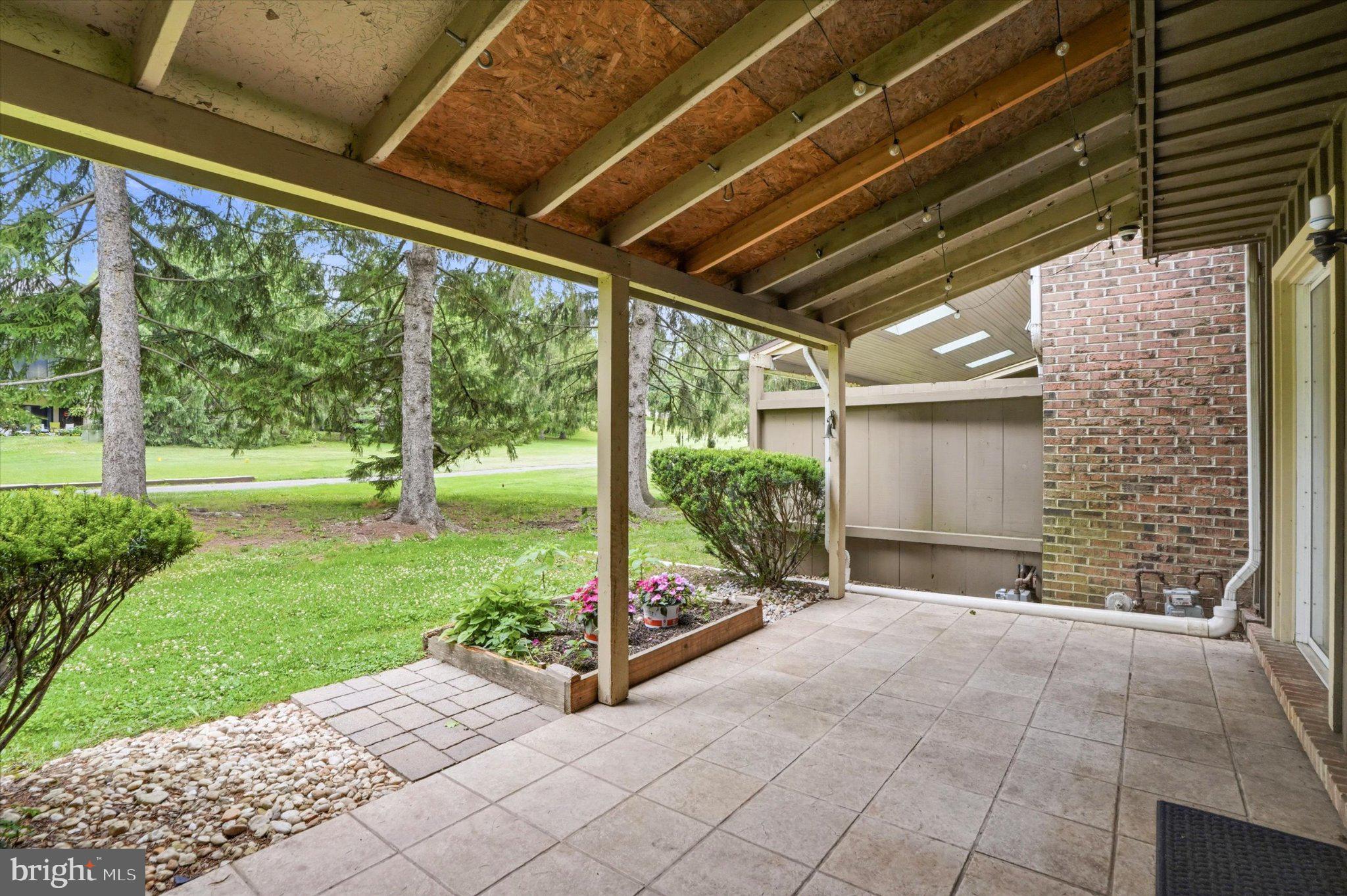 18 Medinah Drive Reading, PA 19607 - Photo 6 of 25 Serene patio with lush greenery.