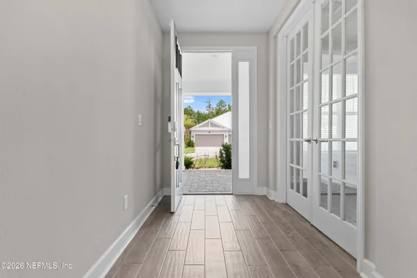 wooden floor in an empty room with a window