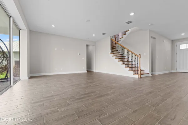 a large kitchen with kitchen island a sink stainless steel appliances and cabinets