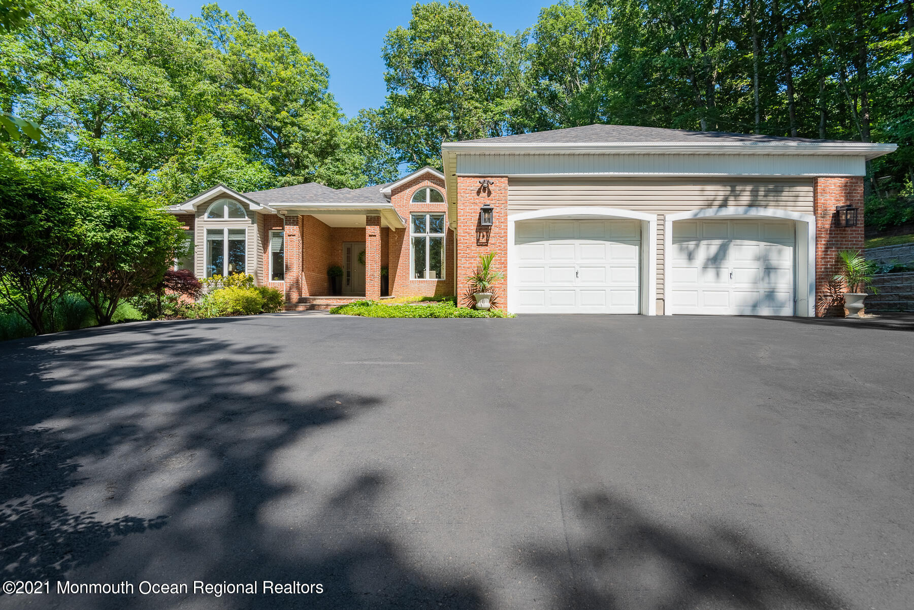 17 Highpoint Road Holmdel, NJ 07733 - Photo 1 of 21 a front view of a house with a garden