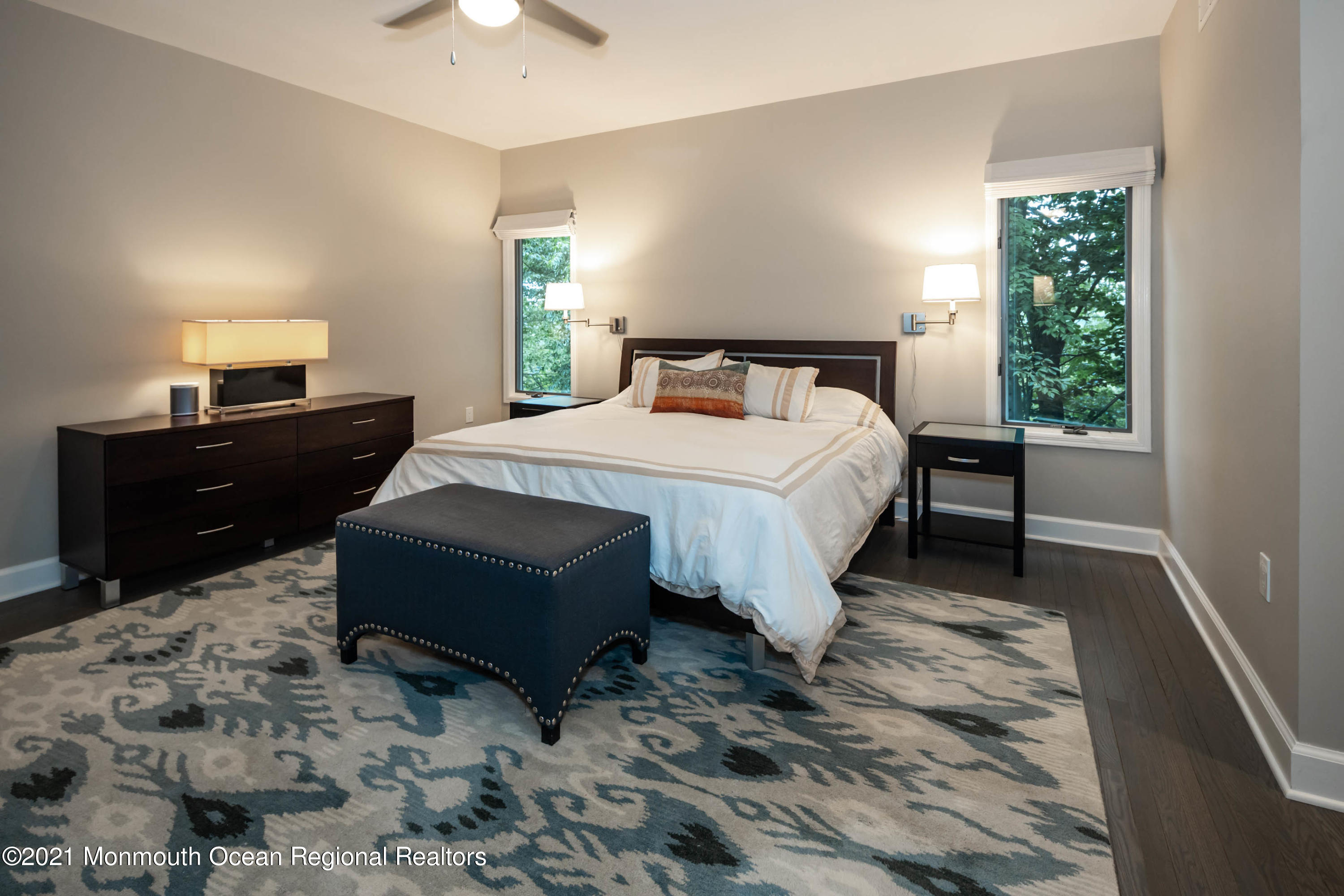 17 Highpoint Road Holmdel, NJ 07733 - Photo 13 of 21 a large bed sitting in a bedroom next to a window with lamp