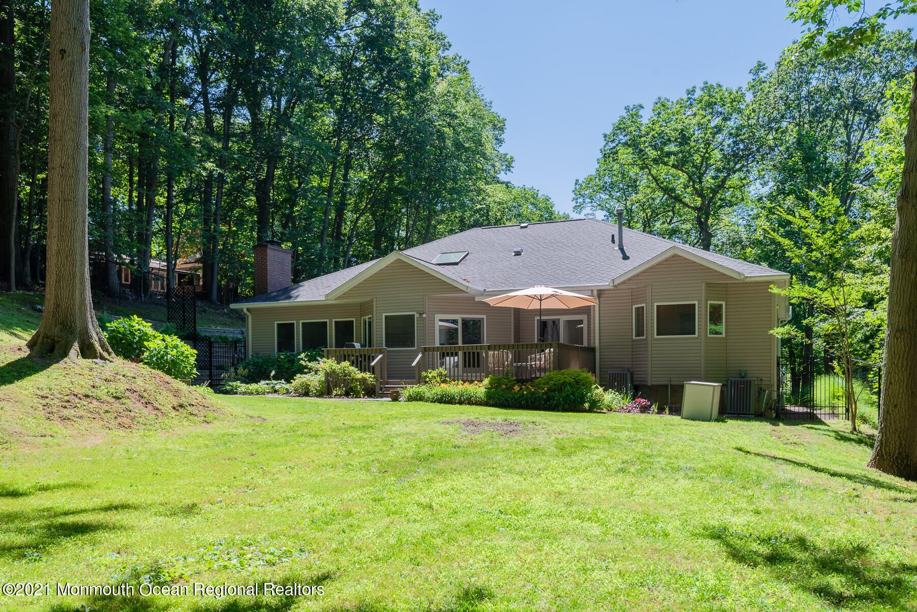 17 Highpoint Road Holmdel, NJ 07733 - Photo 18 of 21 a front view of a house with a yard