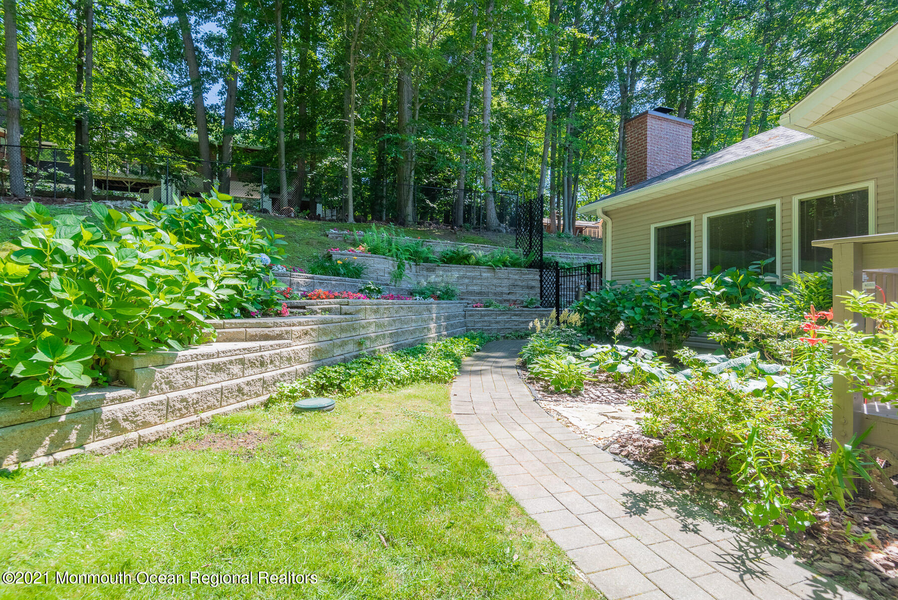 17 Highpoint Road Holmdel, NJ 07733 - Photo 19 of 21 a view of a garden with a fountain