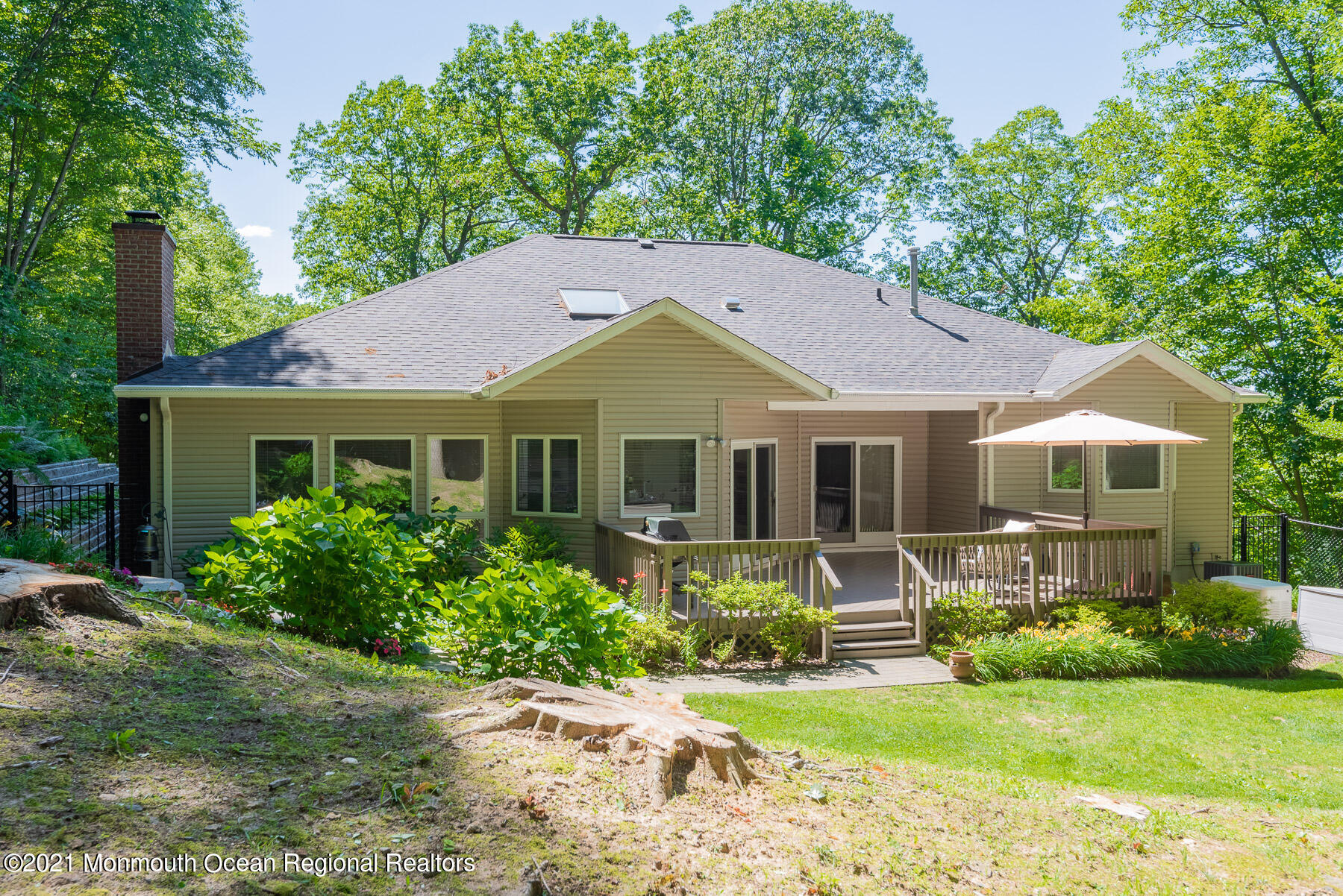 17 Highpoint Road Holmdel, NJ 07733 - Photo 20 of 21 a front view of a house with garden