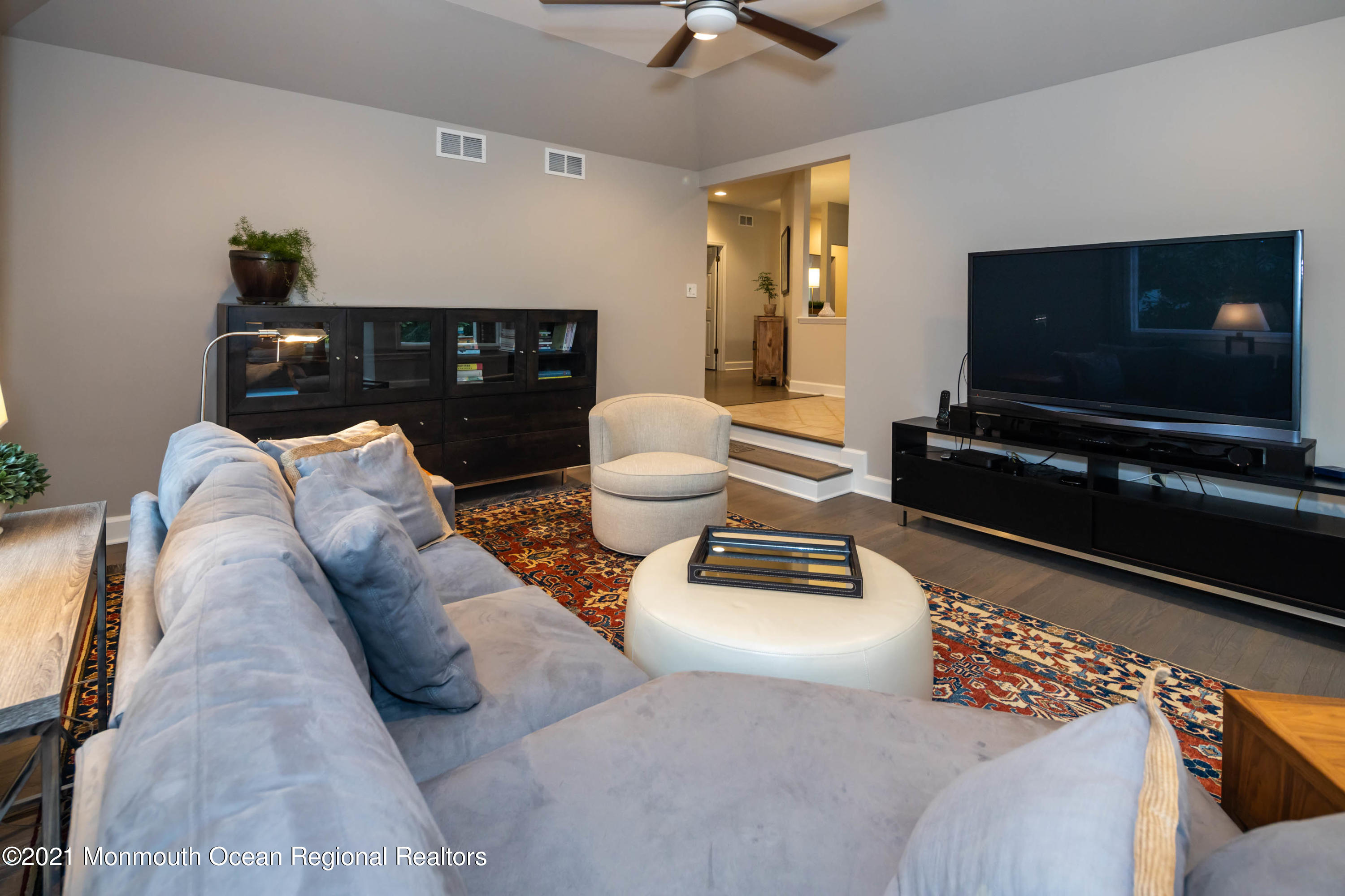 17 Highpoint Road Holmdel, NJ 07733 - Photo 3 of 21 a living room with furniture and a flat screen tv