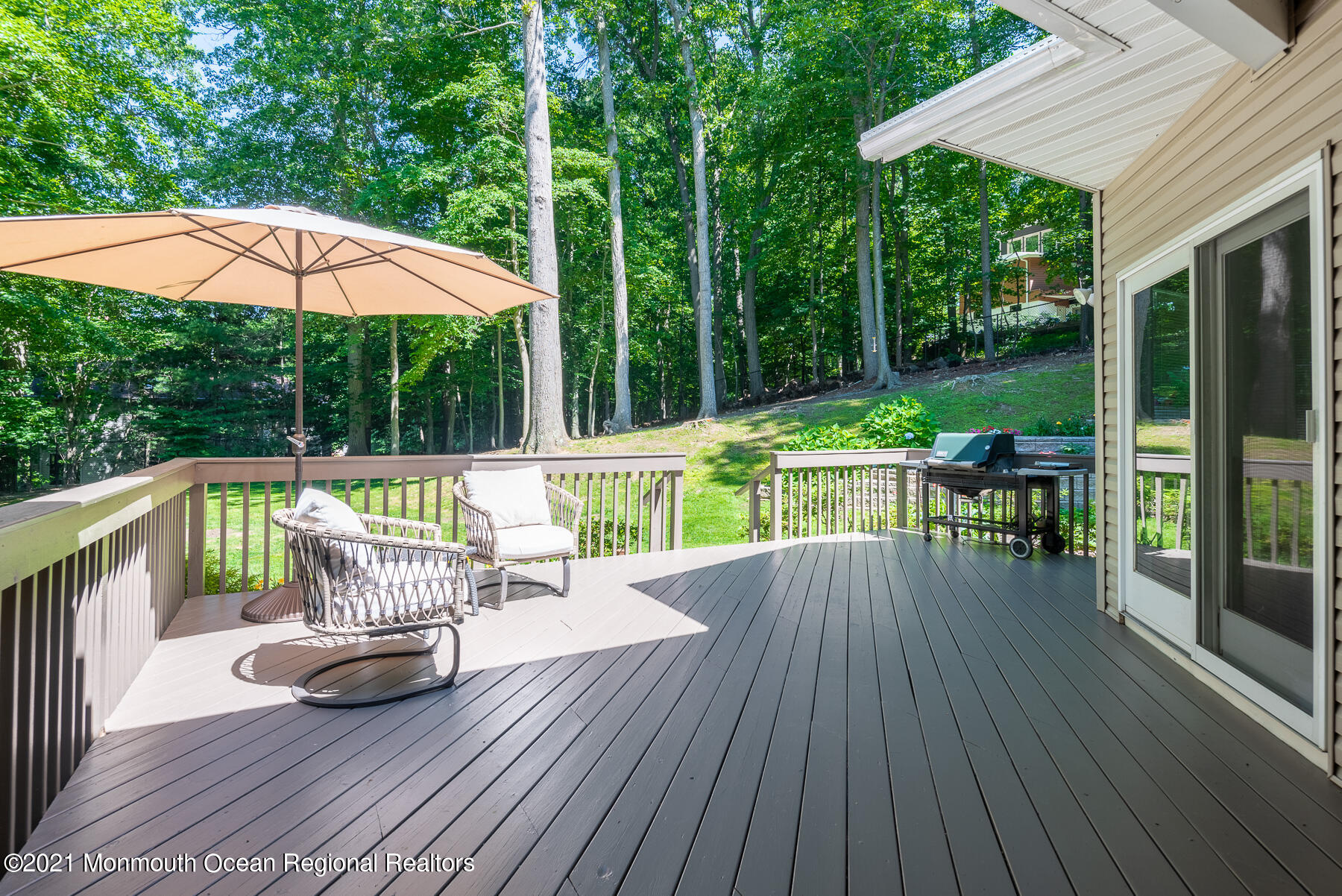 17 Highpoint Road Holmdel, NJ 07733 - Photo 21 of 21 a view of a deck with wooden floor and outdoor seating