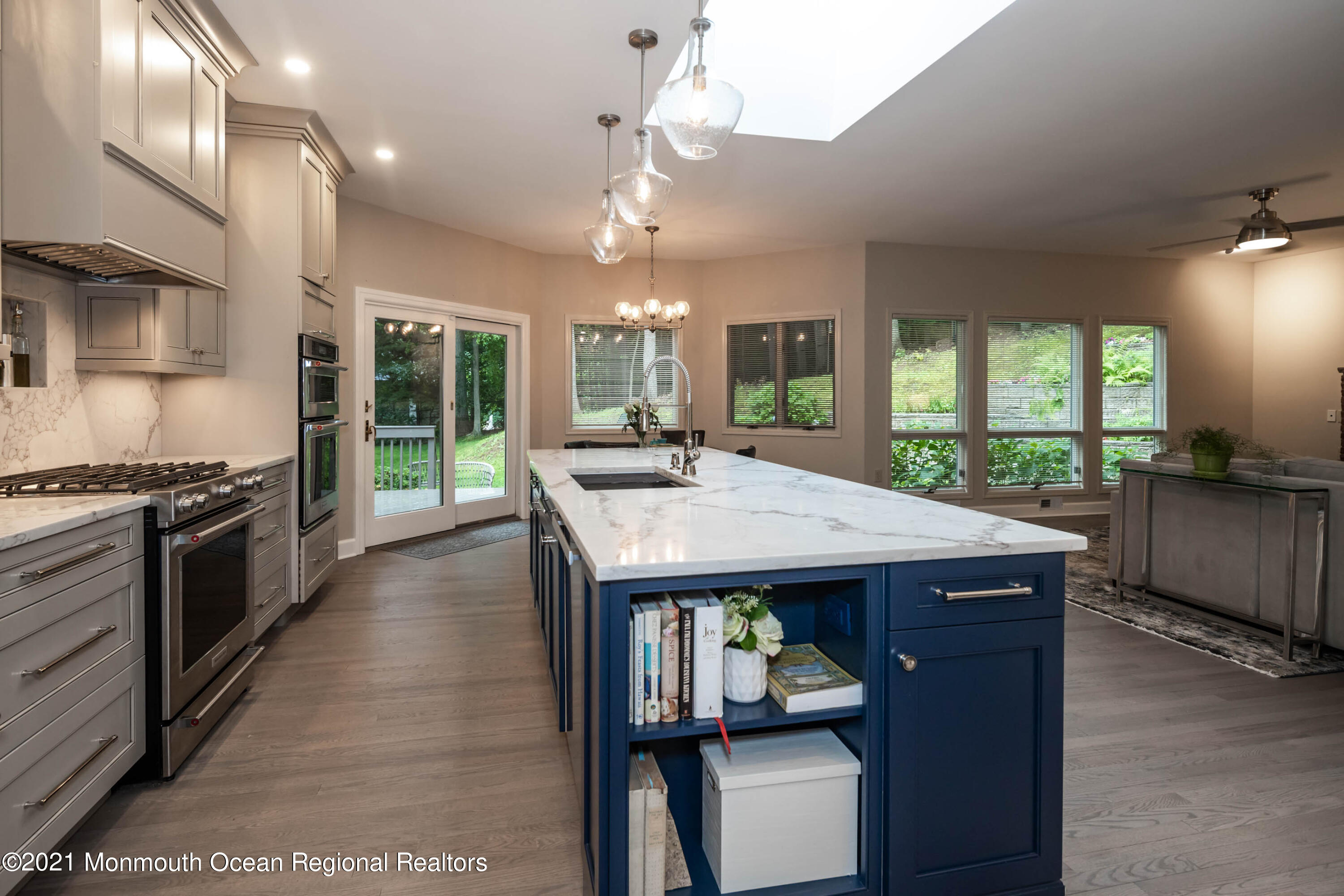17 Highpoint Road Holmdel, NJ 07733 - Photo 8 of 21 a kitchen with granite countertop a stove a sink a dining table and chairs