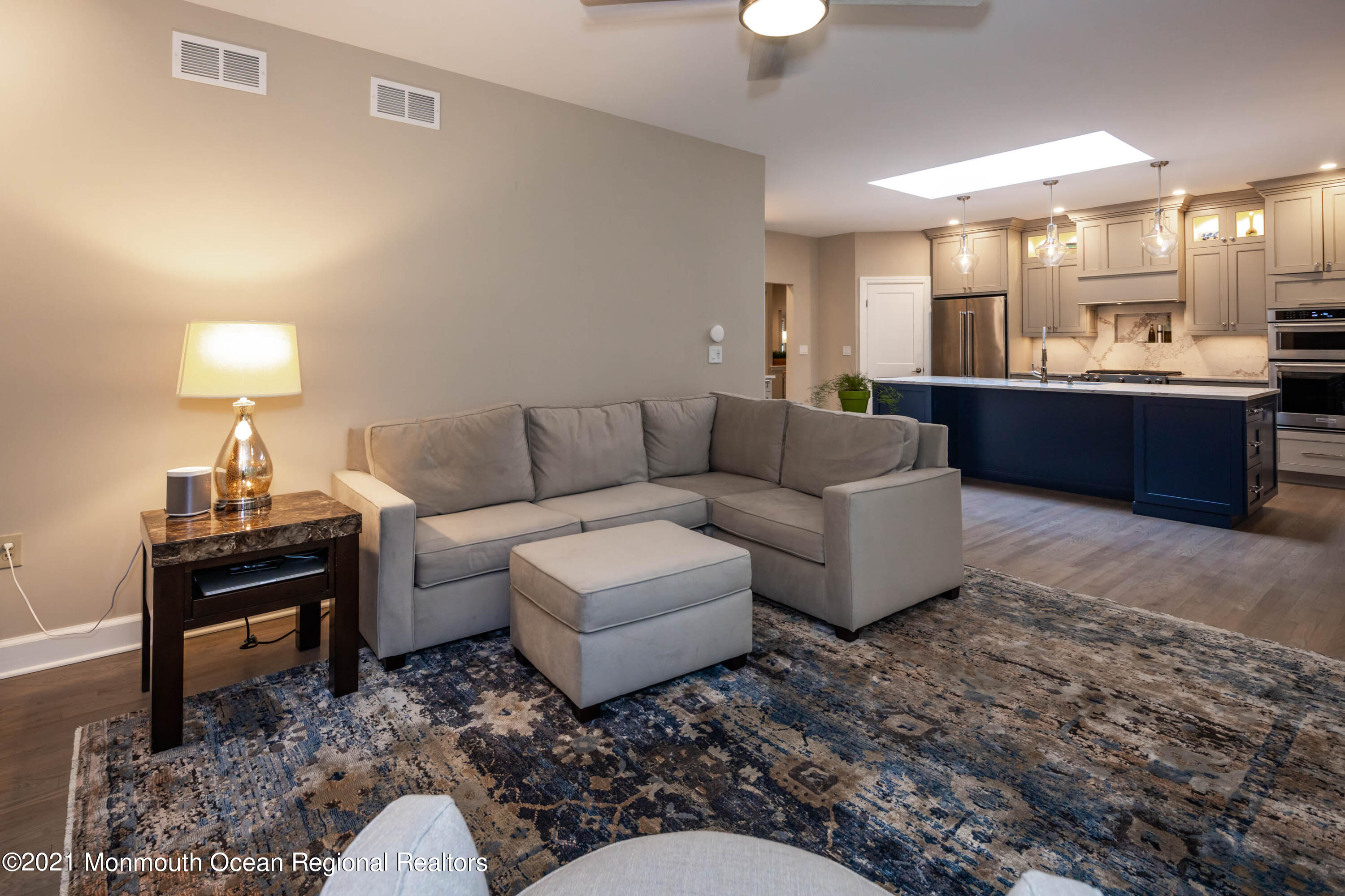 17 Highpoint Road Holmdel, NJ 07733 - Photo 10 of 21 a living room with furniture and a lamp