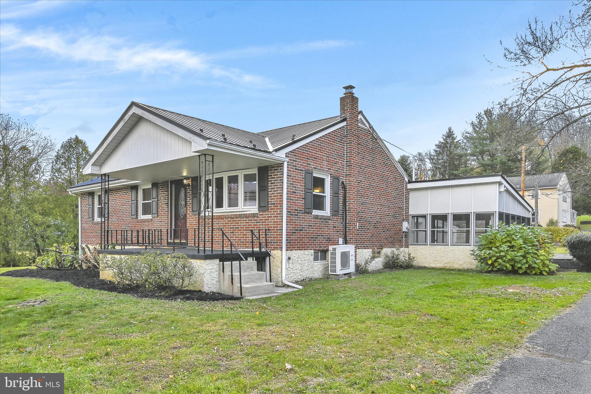986 Fritztown Road Reading, PA 19608 - Photo 1 of 45 a front view of a house with a garden and plants