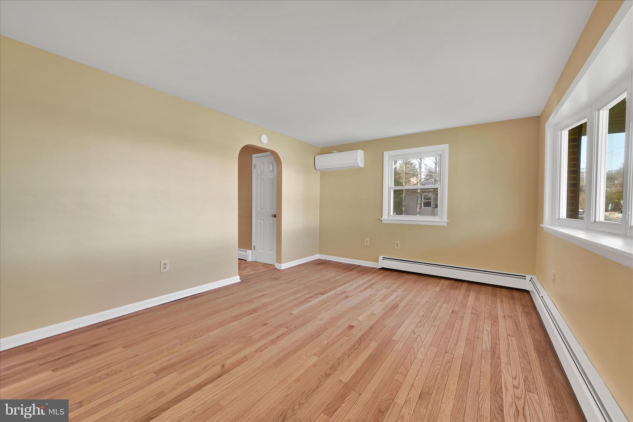 986 Fritztown Road Reading, PA 19608 - Photo 12 of 45 an empty room with wooden floor and windows
