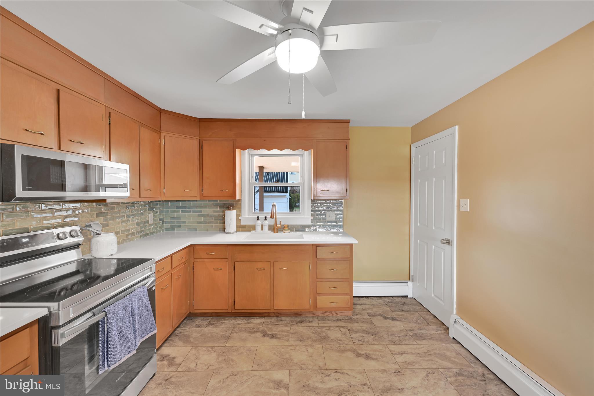 986 Fritztown Road Reading, PA 19608 - Photo 15 of 45 a large kitchen with stainless steel appliances granite countertop a sink and cabinets