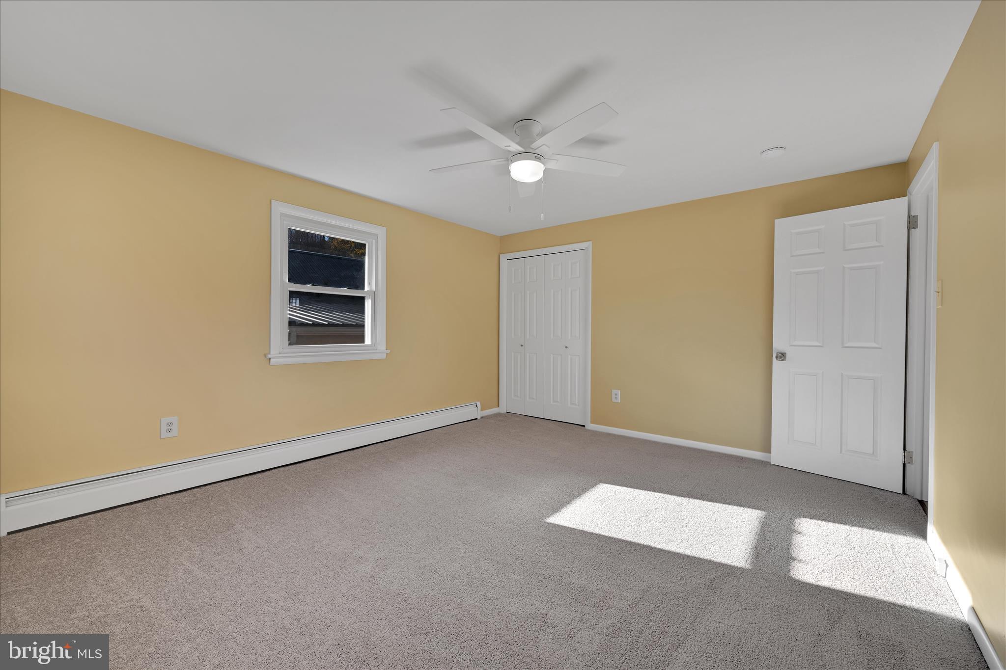 986 Fritztown Road Reading, PA 19608 - Photo 20 of 45 an empty room with a ceiling fan and window