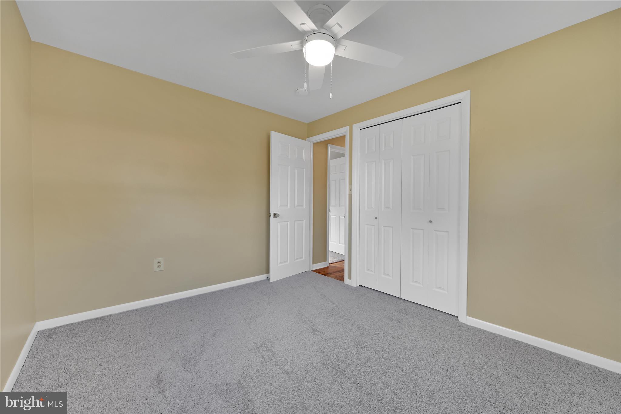 986 Fritztown Road Reading, PA 19608 - Photo 26 of 45 an empty room with closet and a chandelier fan