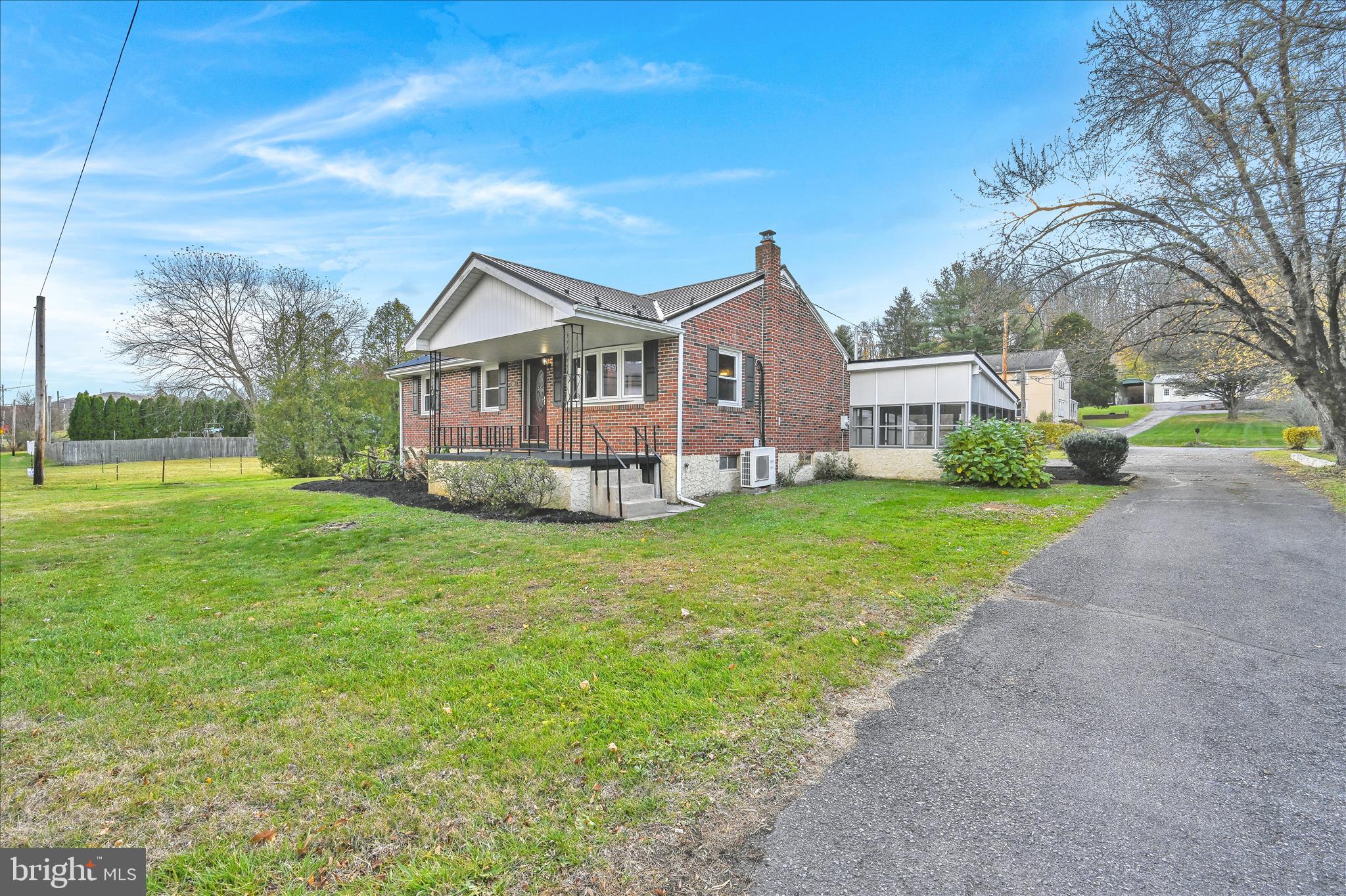 986 Fritztown Road Reading, PA 19608 - Photo 9 of 45 a front view of a house with a yard and large trees