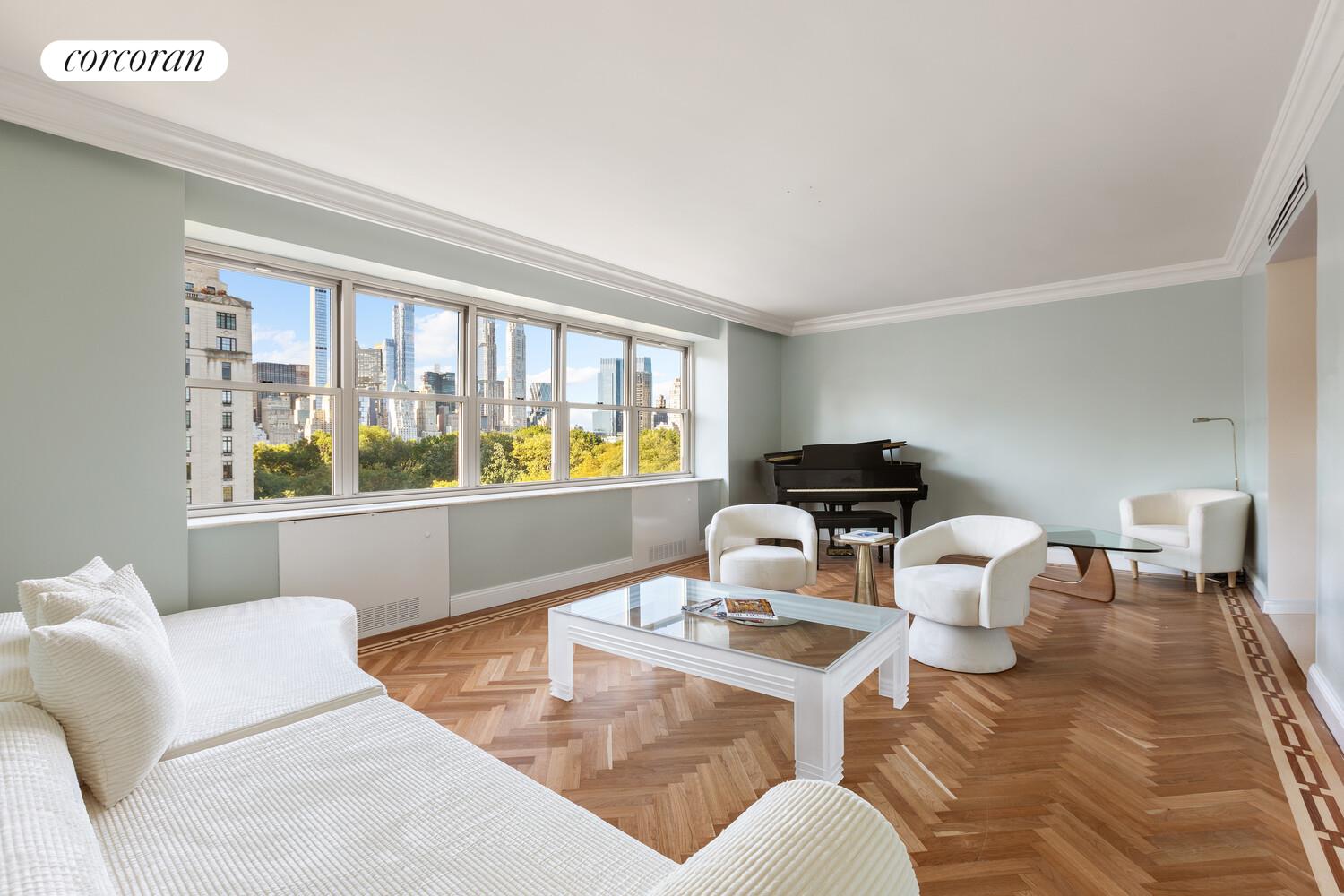 900 5th Avenue, Unit 10C Manhattan, NY 10021 - Photo 1 of 15 a living room with furniture and window
