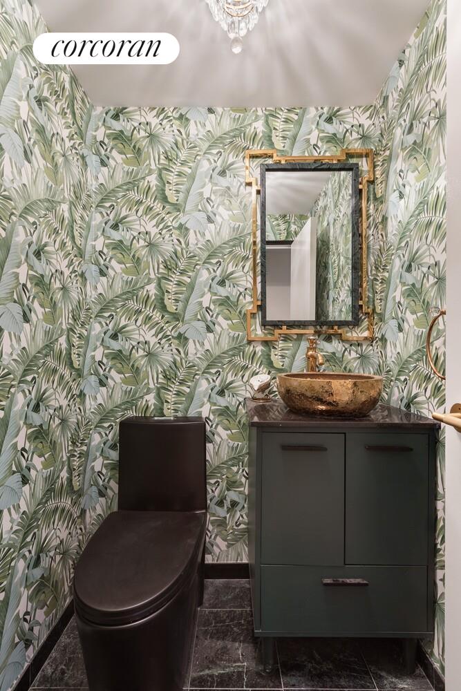 900 5th Avenue, Unit 10C Manhattan, NY 10021 - Photo 7 of 15 a bathroom with a toilet and a sink