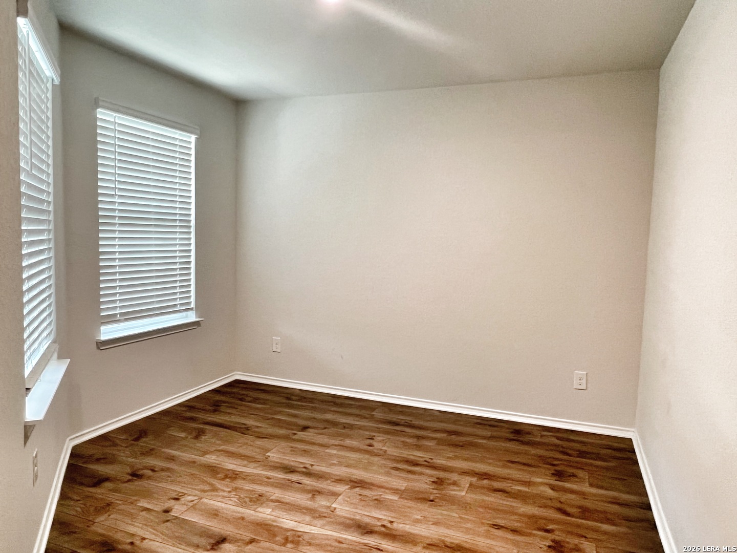 29529 Spring Copper Bulverde, TX 78163 - Photo 9 of 41 wooden floor in an empty room with a window