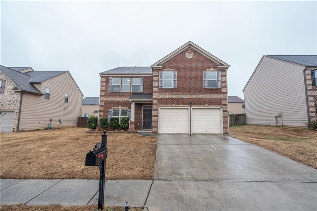 3107 Rex Ridge Circle Rex, GA 30273 - Photo 1 of 1 a view of a house with a yard and garage
