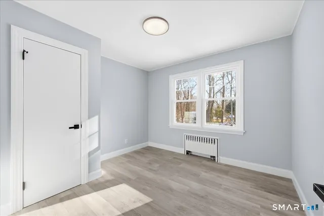 a view of an empty room with a window