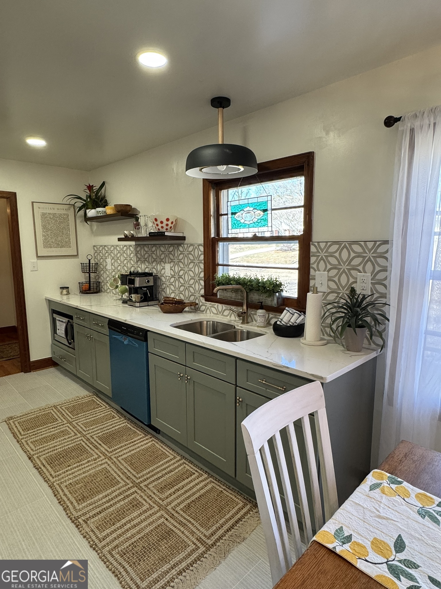 410 Sunset Circle Forsyth, GA 31029 - Photo 15 of 27 a kitchen with a sink appliances and cabinets