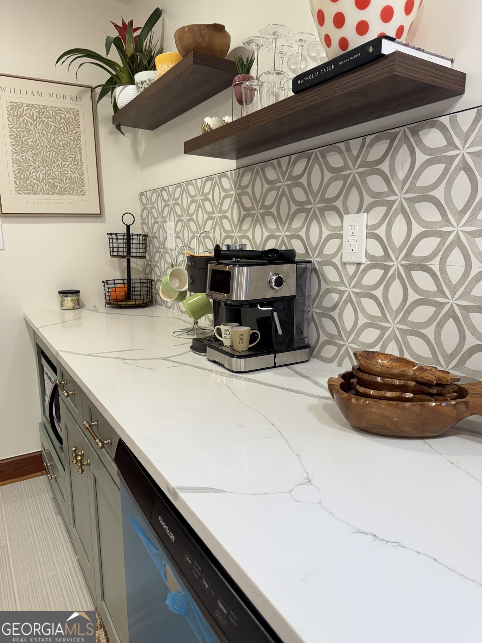 410 Sunset Circle Forsyth, GA 31029 - Photo 22 of 27 a kitchen with a sink and cabinets