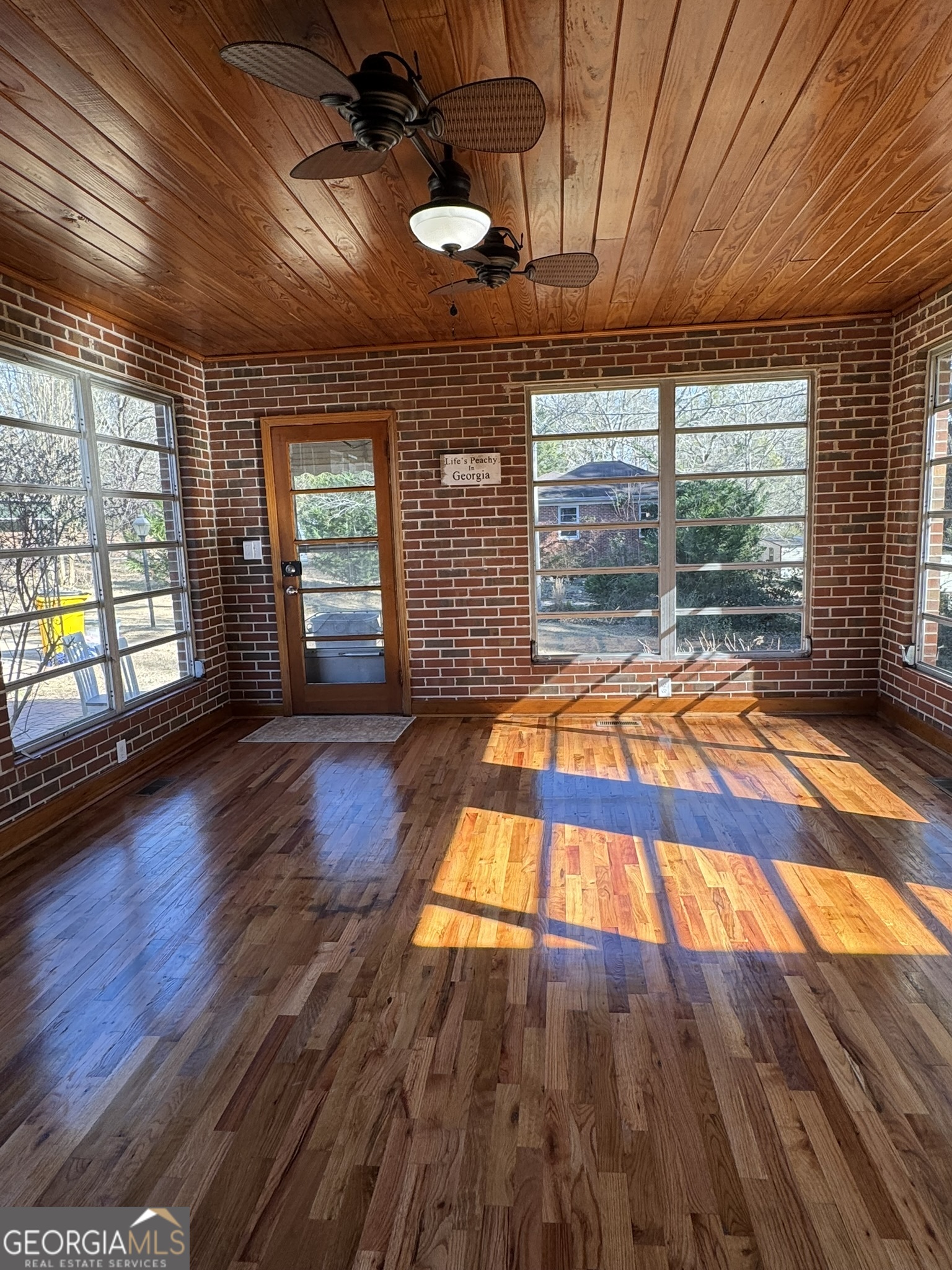 410 Sunset Circle Forsyth, GA 31029 - Photo 25 of 27 a view of an empty room with window and wooden floor