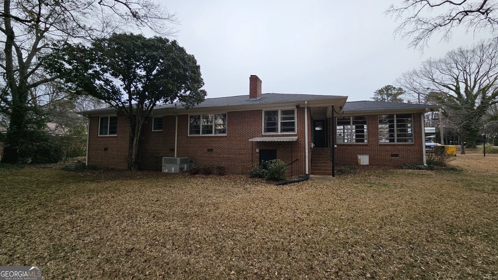 410 Sunset Circle Forsyth, GA 31029 - Photo 27 of 27 front view of a house with a yard