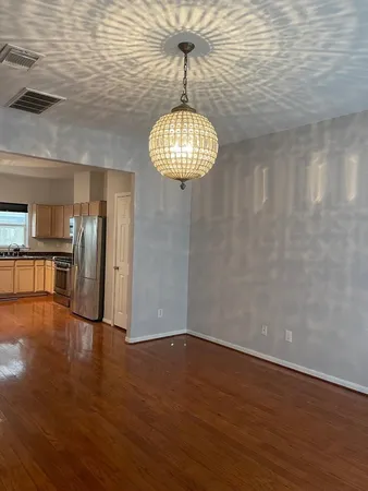 a view of a livingroom with wooden floor