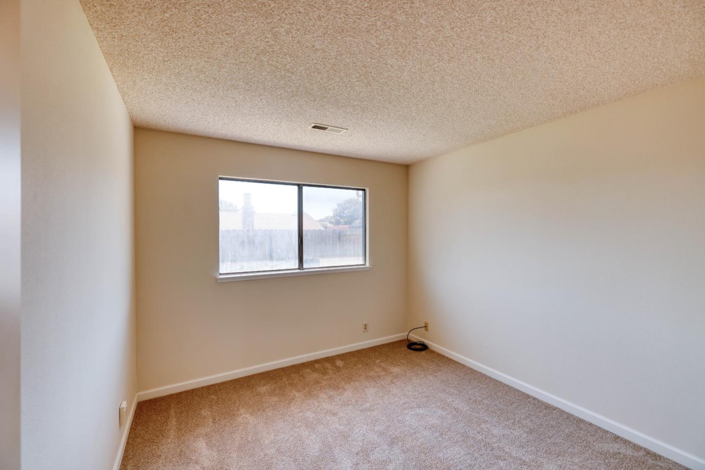 13 Victor Circle Salinas, CA 93907 - Photo 7 of 18 an empty room with a window