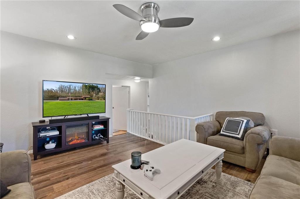 134 Wilson Avenue Cecil, PA 15321 - Photo 13 of 25 a living room with furniture and a flat screen tv