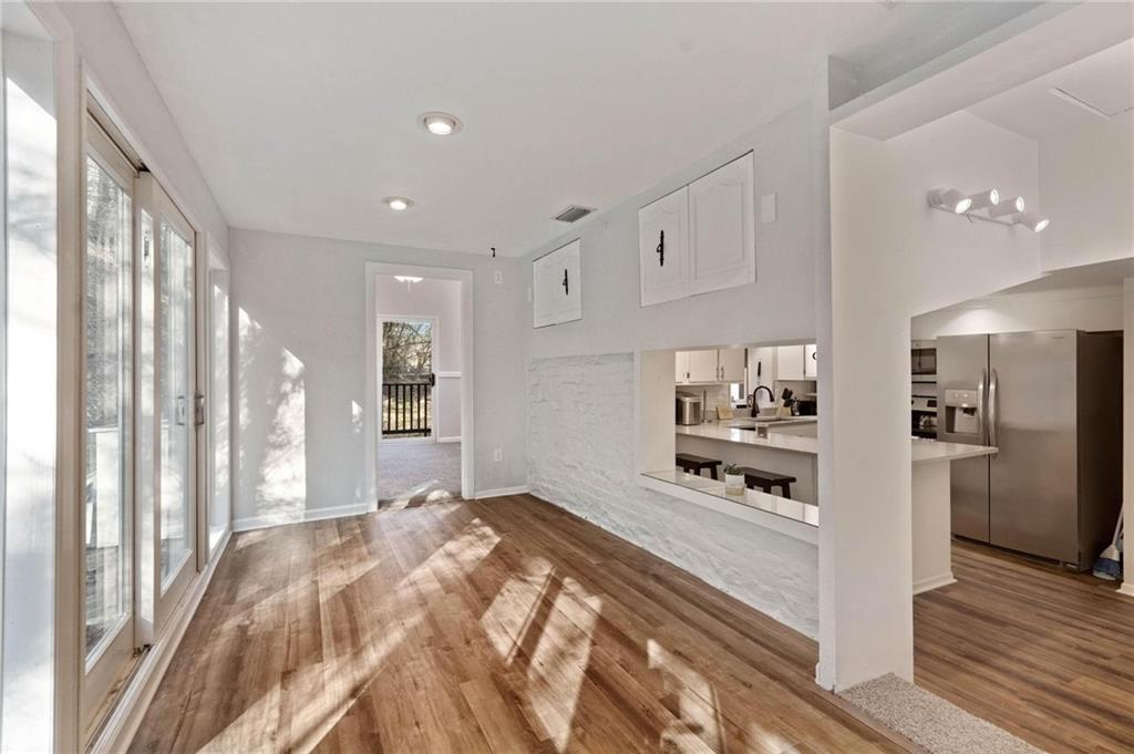 134 Wilson Avenue Cecil, PA 15321 - Photo 19 of 25 a large white kitchen with stainless steel appliances a refrigerator and a stove top oven