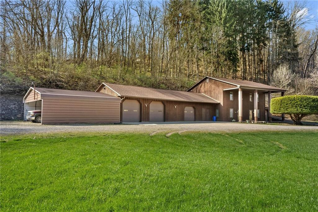 134 Wilson Avenue Cecil, PA 15321 - Photo 2 of 25 a front view of a house with a garden