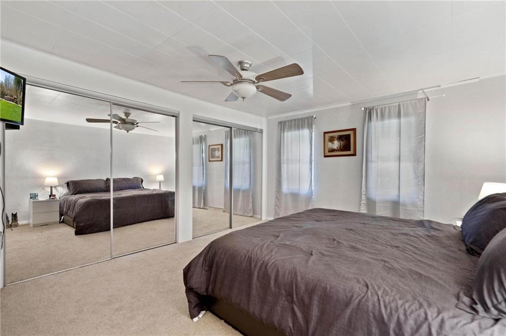 134 Wilson Avenue Cecil, PA 15321 - Photo 22 of 25 a spacious bedroom with a bed and a shower