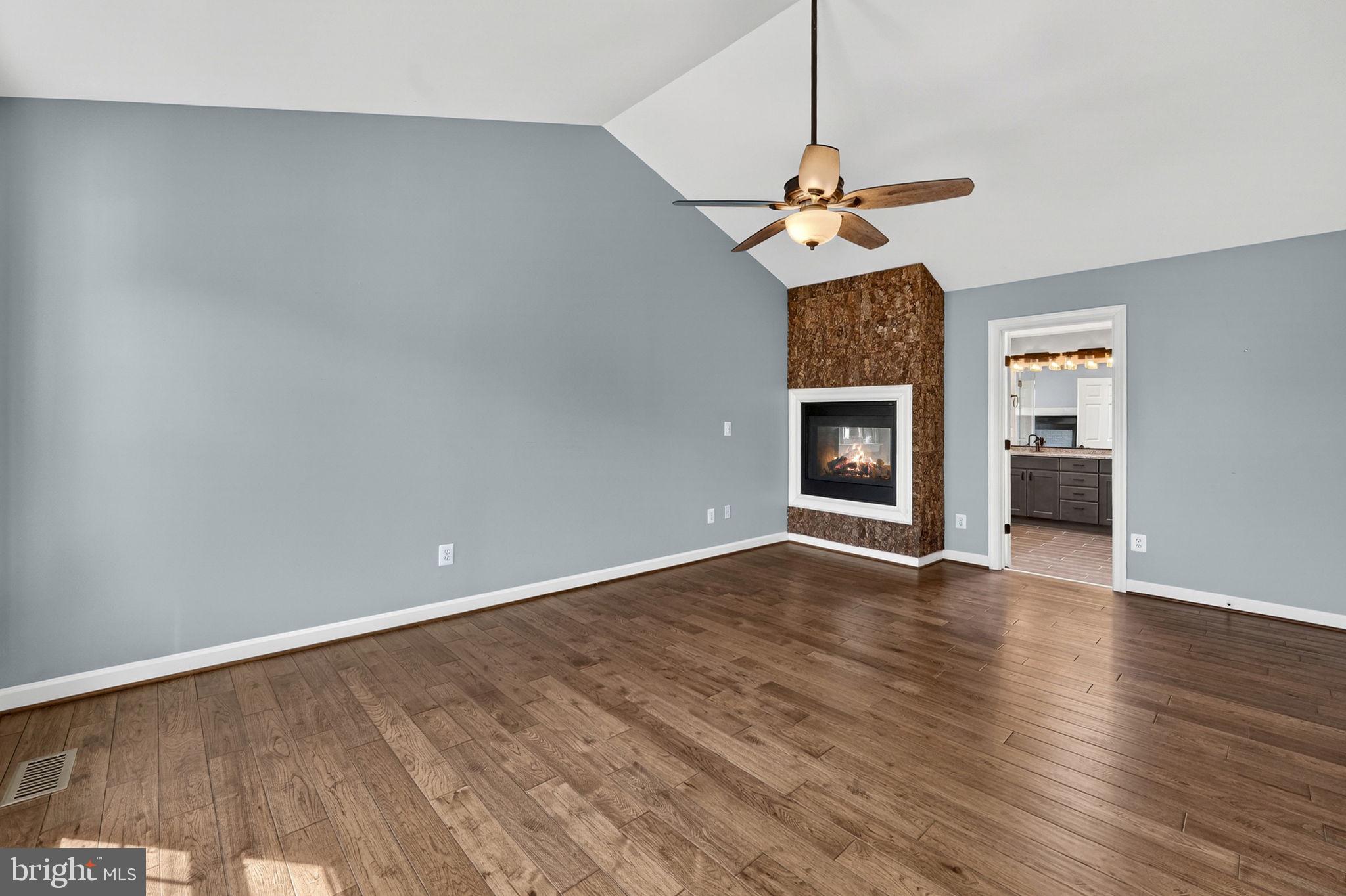 42943 Gotham Way Ashburn, VA 20147 - Photo 24 of 53 Primary bedroom with pass through gas fireplace